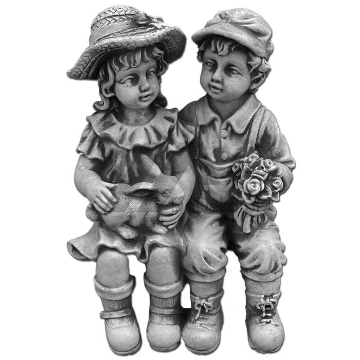 Niña y niño - figuras de hormigón